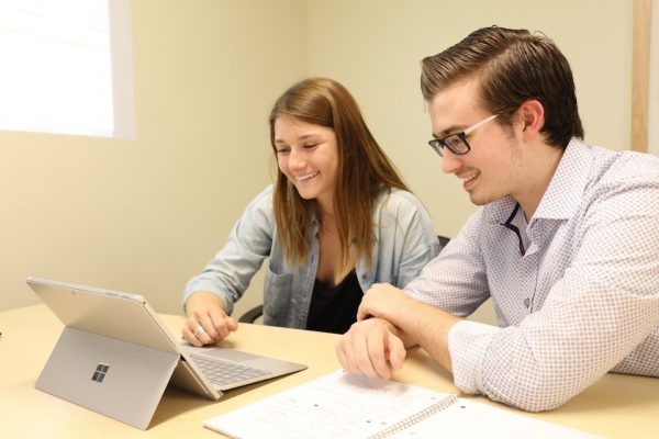 Hayley Winslow ‘18 discusses business plans for the Institute for Local Food Systems Innovation with Nick Guidi ’20, who is a renewable energy analyst intern for the College’s Mission-Aligned Businesses.