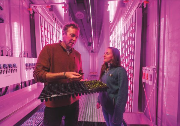 Professor and student working in the College's Freight Farm