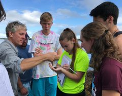 Professor Steve Jury works with science scholars out in the field