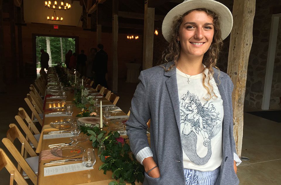 Elyse Caiazzo ’18 in the Stone Barn before a community dinner begins