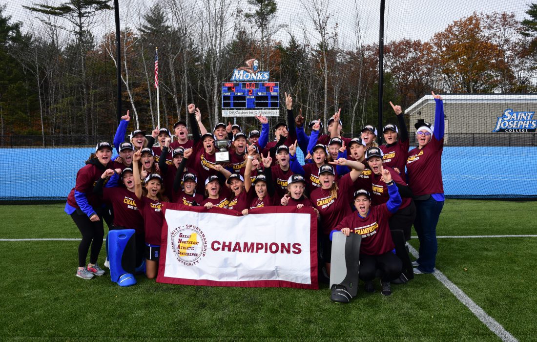 Field hockey team group photo after winning the GNAC Championships in 2018