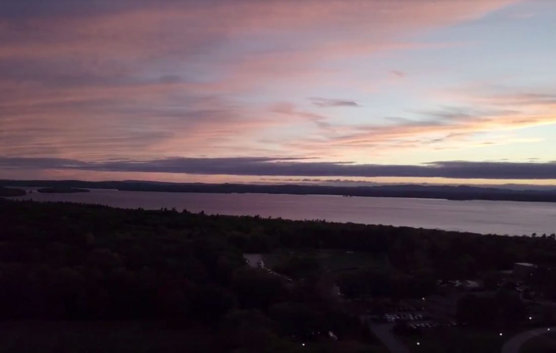 drone shot of a sunset on Sebago Lake