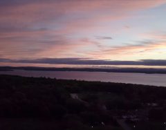 drone shot of a sunset on Sebago Lake