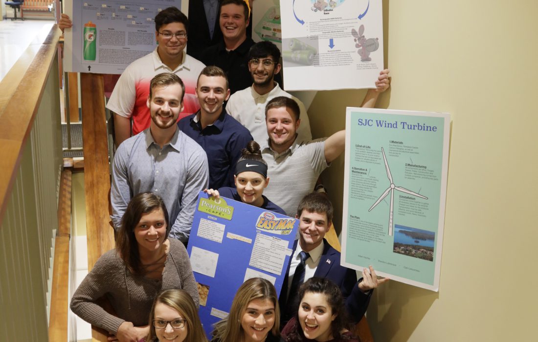 Business Ethics students celebrate after completing their Life Cycle Assessment presentations.