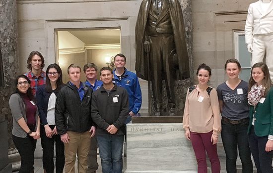 Marisellia Greenlaw ’18, Matthew Gregoire ’18, Olivia Wilkinson ’21, Paul Riley ’20, Sean Peschier ’20, William Hardiman ’19, Raymond Mosca ’19 (in front), Paul Riley ’20 (in back), Erin O’Brien ’19, Emma Tirrell ’18, and Elizabeth Cummons ’19 visit the statue of Hannibal Hamlin at the Capitol Building Rotunda.