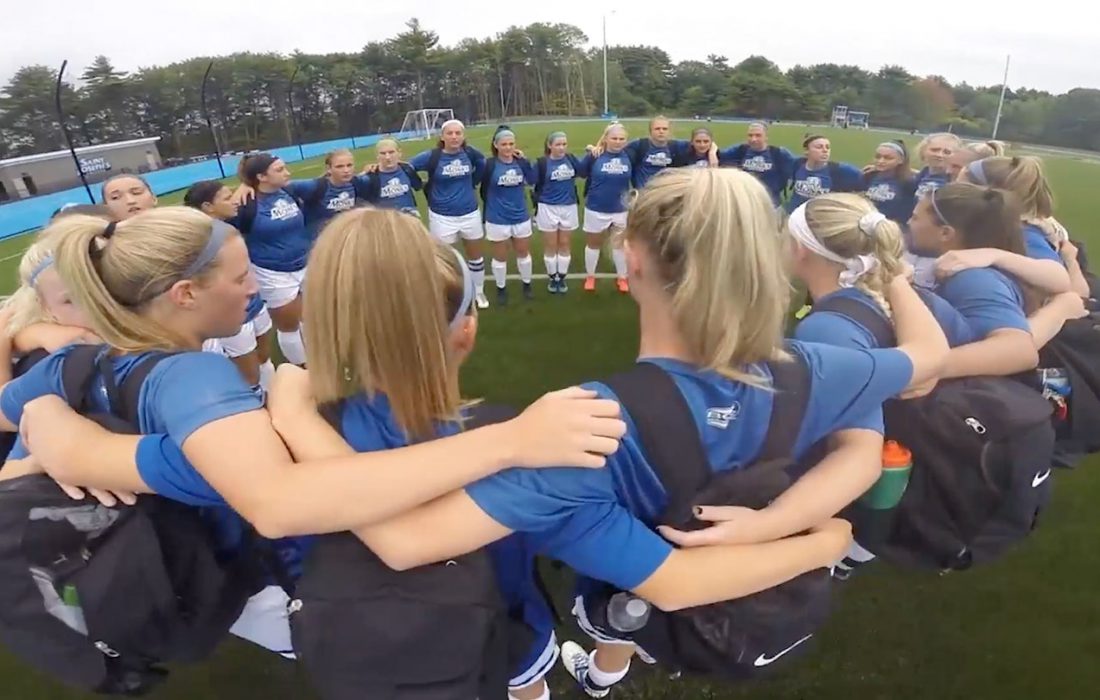 women's soccer team huddle in a circle