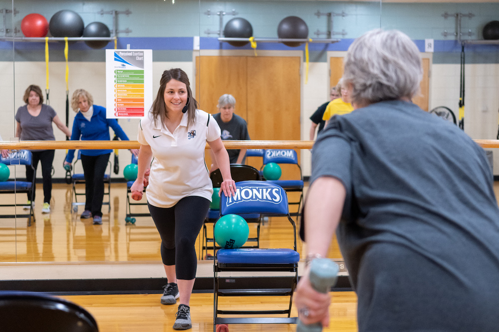 SilverSneakers instructor Chelsea Diamond teaches a fitness class for older adults in the Alfond Center at Saint Joseph's College of Maine.