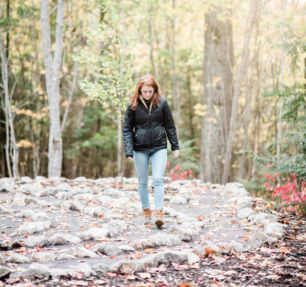 A student walks along Julie's Path, a labyrinth at Saint Joseph's College of Maine. PHOTO: CHRISTINA WNEK